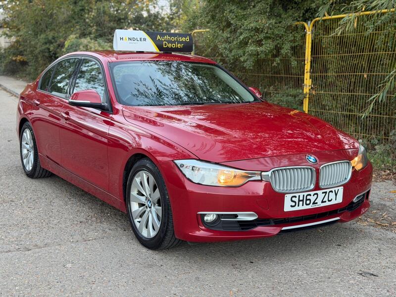 Red BMW 3 Series on the forecourt